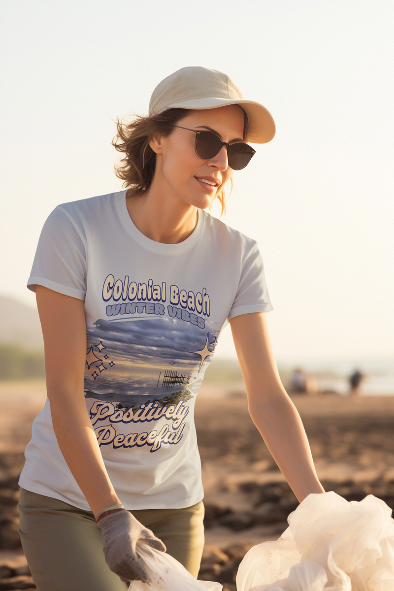 woman wearing colonial beach winter vibes heather grey premium t-shirt during beach cleanup