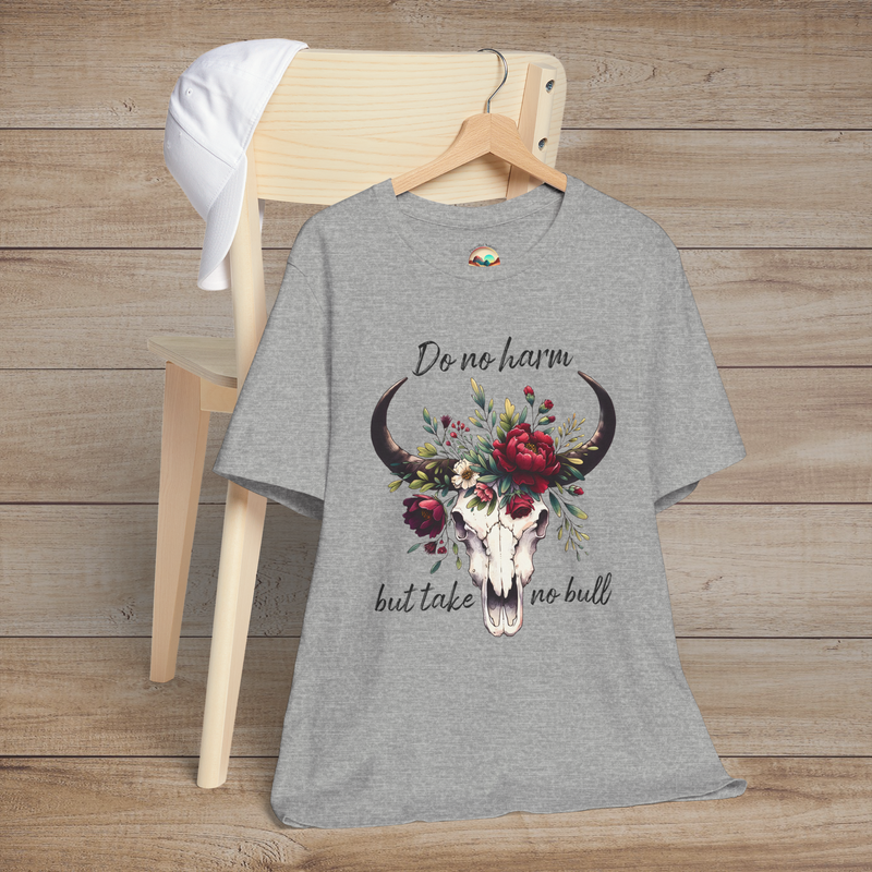 Flat lay of "Do No Harm But Take No Bull" t-shirt in heather grey with bull skull and floral crown
