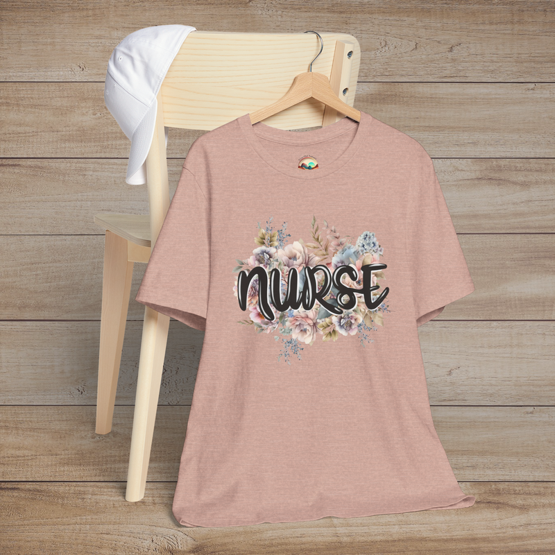 Heather prism peach Nurse Floral Premium Fit T-Shirt displayed beautifully on hanger, adorned with gentle pastel florals and scripted "Nurse"