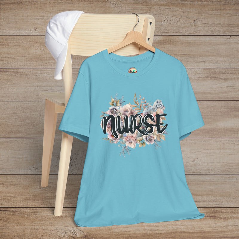 Turquoise Nurse Floral Premium Fit T-Shirt hanging on wooden hanger, featuring pastel floral design with graceful black text