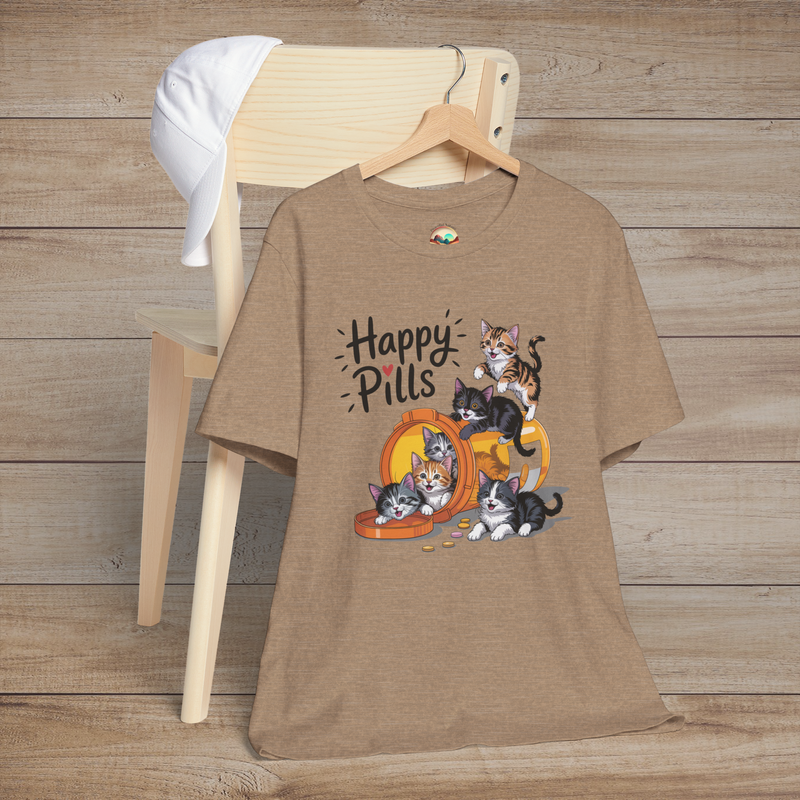 Happy Pills t-shirt on heather tan background, featuring playful kittens around an orange bottle