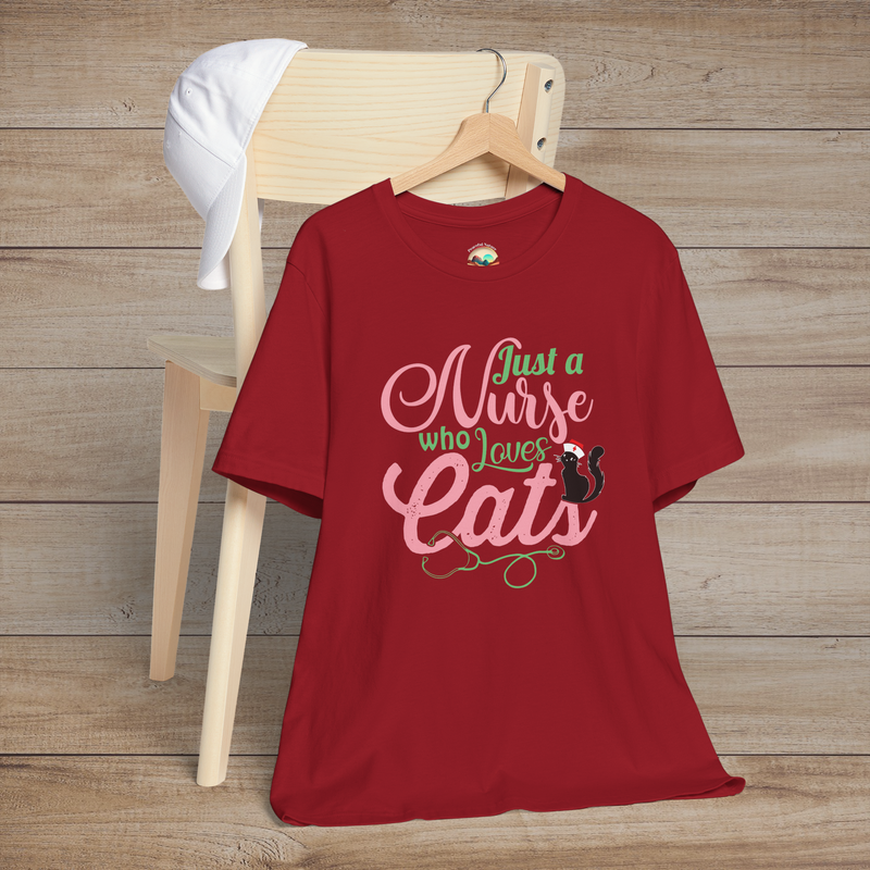 Canvas red t-shirt with pink and green script Just a Nurse Who Loves Cats featuring a playful black cat wearing a nurse cap