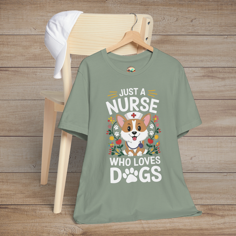 Sage green t-shirt featuring a cheerful dog in a nurse hat surrounded by paw prints and flowers, caption reads Just a Nurse Who Loves Dogs