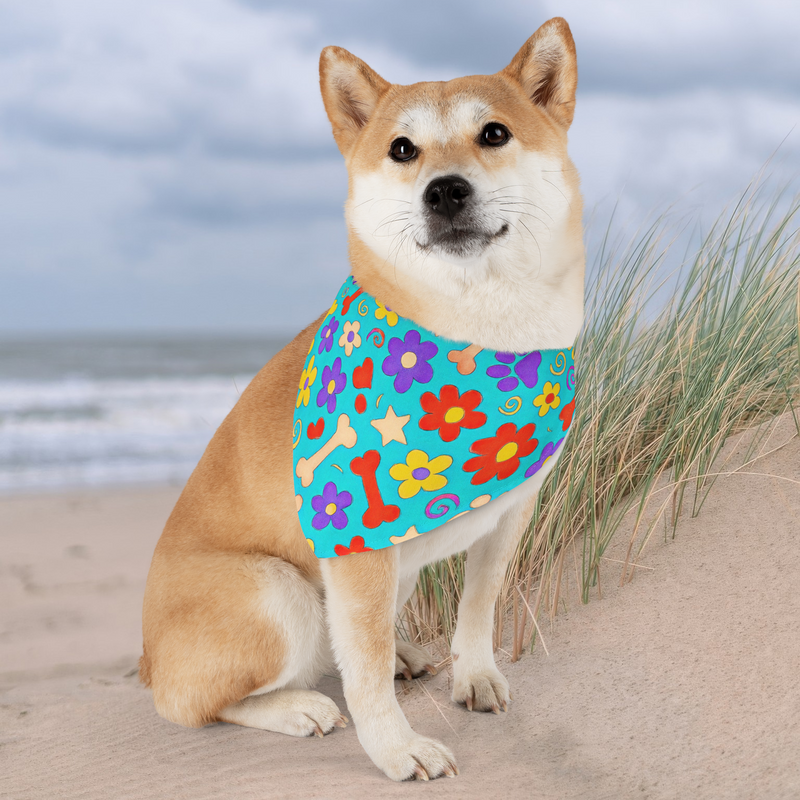 Shiba Inu dog on beach wearing colorful floral bandana with secure collar