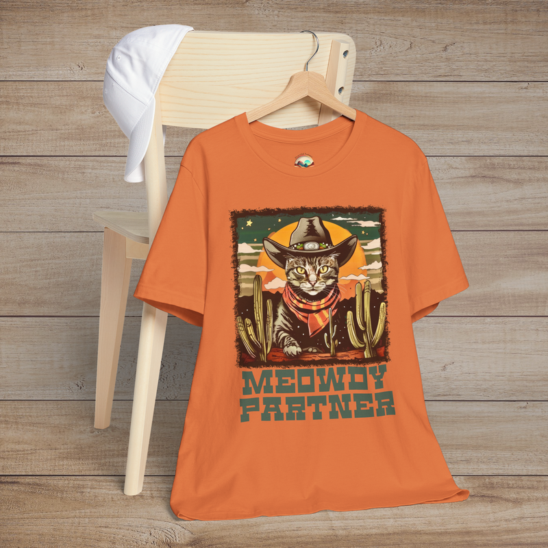Burnt Orange Meowdy Partner Cowboy Cat Tee showcasing a humorous feline cowboy scene complete with hat, scarf, and desert cacti