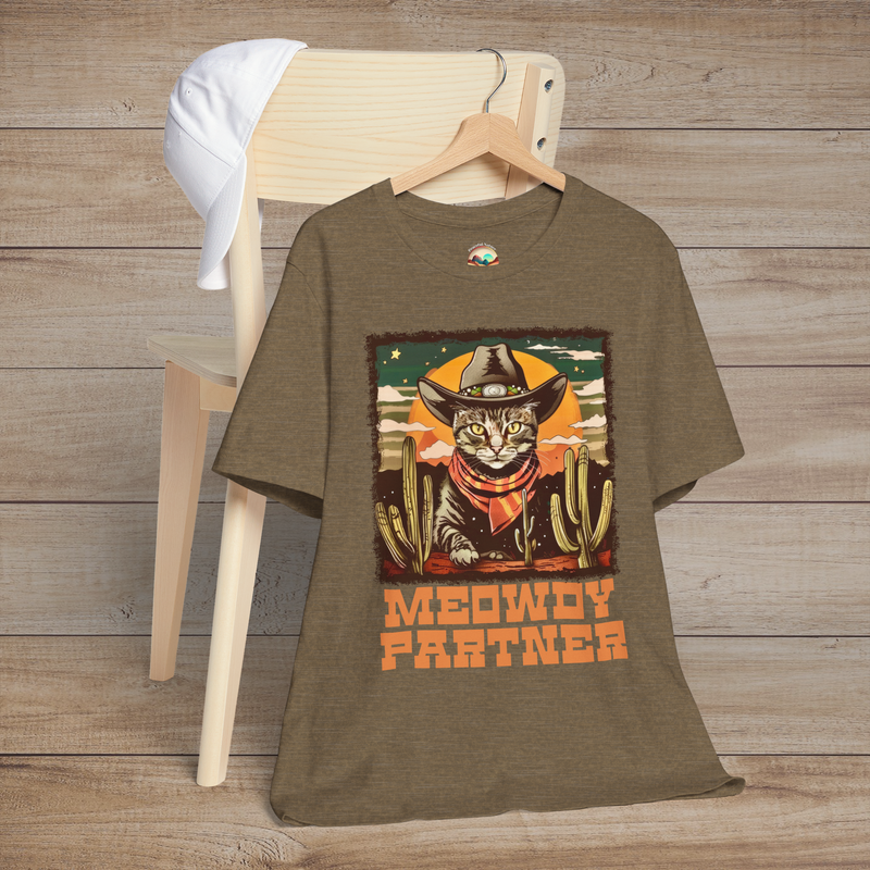 Heather Olive Meowdy Partner T-Shirt with a playful cowboy cat wearing a Western hat and neckerchief surrounded by desert landscape and cacti