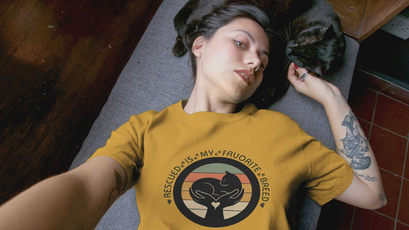 Video of woman with her cat. She is wearing the Rescued is my favorite breed tshirt.