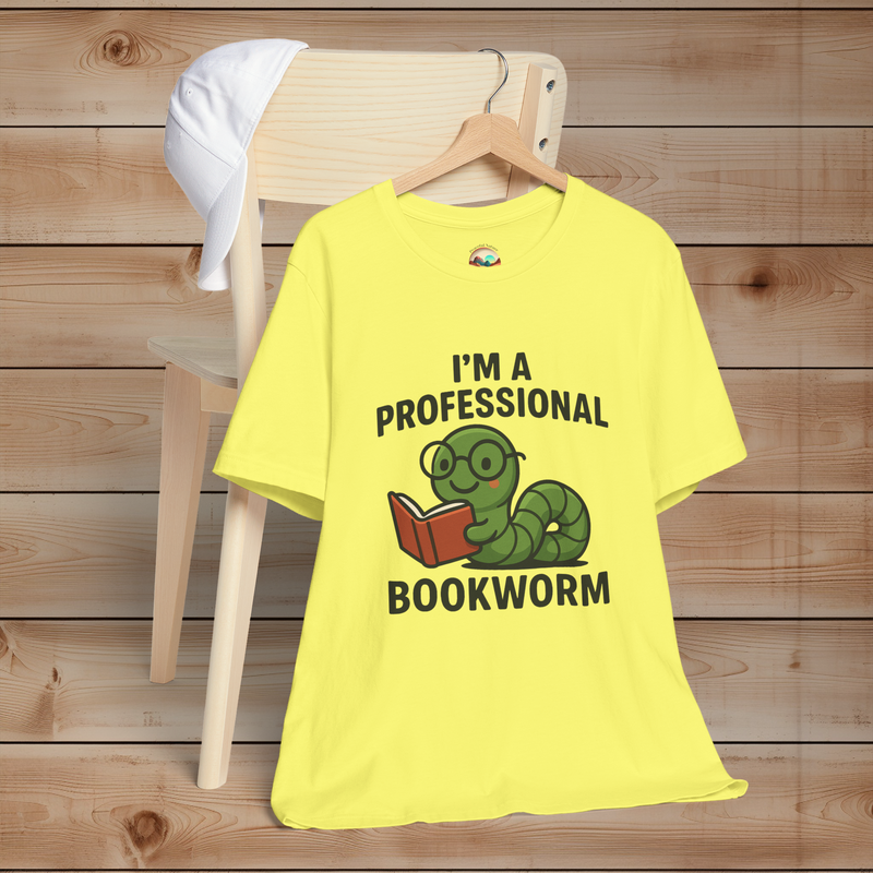 Yellow t-shirt with a bookworm graphic and text on a wooden background