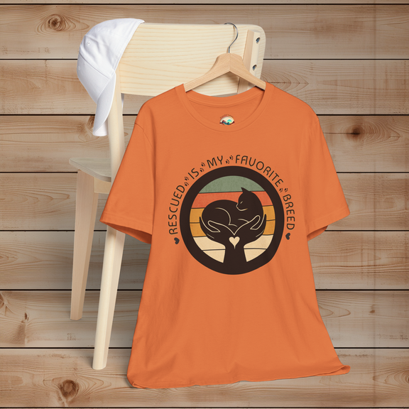Burnt Orange ‘Rescued Is My Favorite Breed’ T-shirt – black cat graphic in gentle hands, retro sunset background, Bella+Canvas 3001