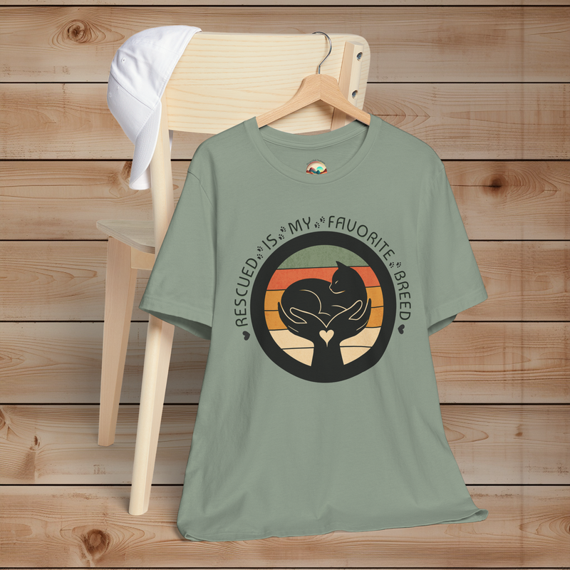 Sage green Bella+Canvas 3001 unisex tee – minimalist cat and hands graphic with vintage stripes, ‘Rescued Is My Favorite Breed’ text.