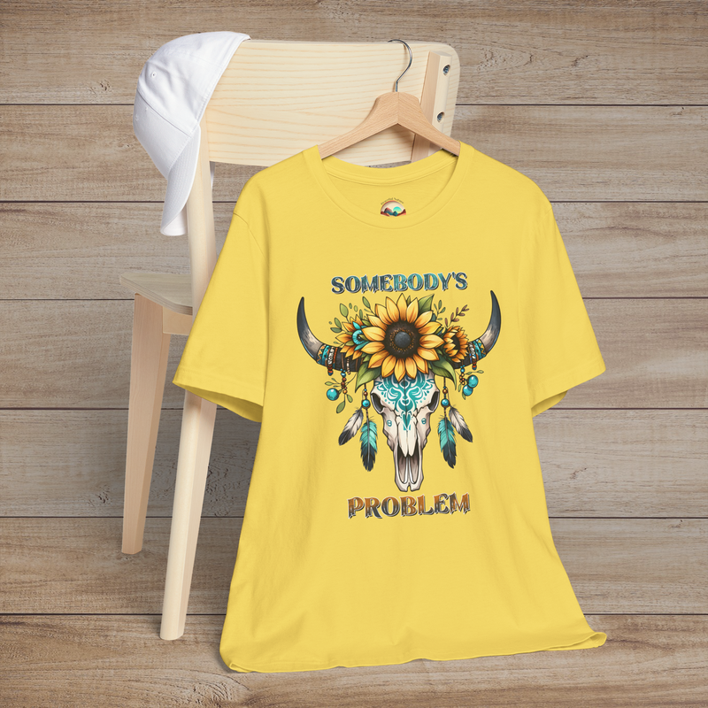 Somebody’s Problem T-Shirt featuring a Boho buffalo skull with feathers and sunflowers on maize yellow fabric