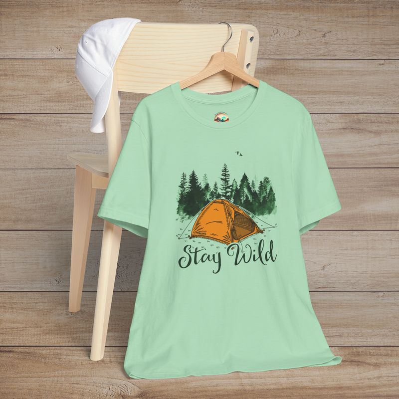 Mint green Stay Wild Camper T-Shirt displaying an orange tent in a pine forest with birds and "Stay Wild" text