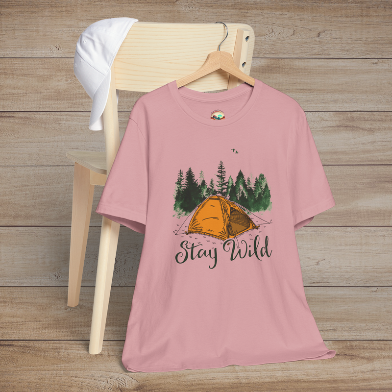 Orchid pink Stay Wild Camper T-Shirt showing an orange camping tent surrounded by evergreen trees and flying birds
