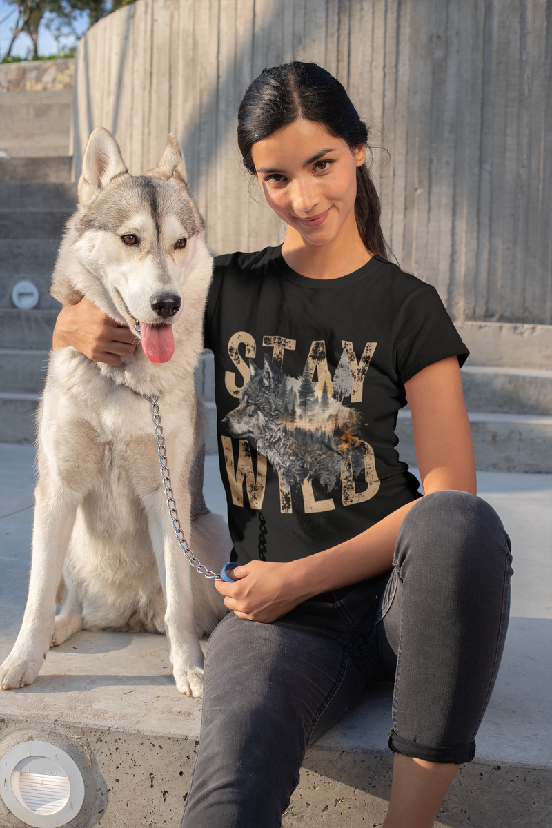 Woman sitting on steps with a Siberian Husky, wearing the Stay Wild wolf t-shirt in black