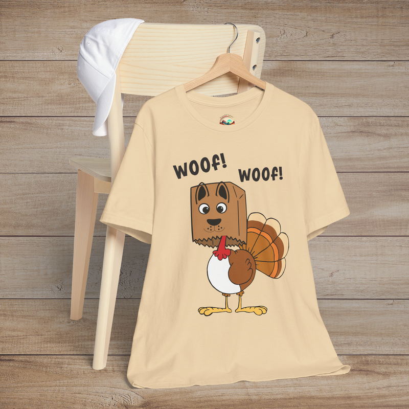 Turkey wearing dog disguise on soft cream t-shirt, funny Thanksgiving design with “Woof! Woof!”