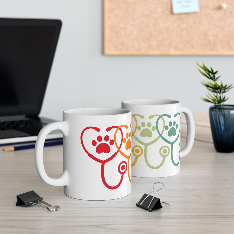 11 oz vet appreciation mug on desk with two mugs visible – left and right design context