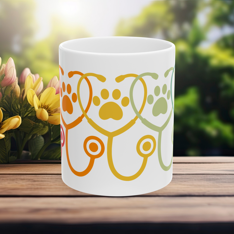 11 oz white mug with colorful stethoscope and paw print design – front view