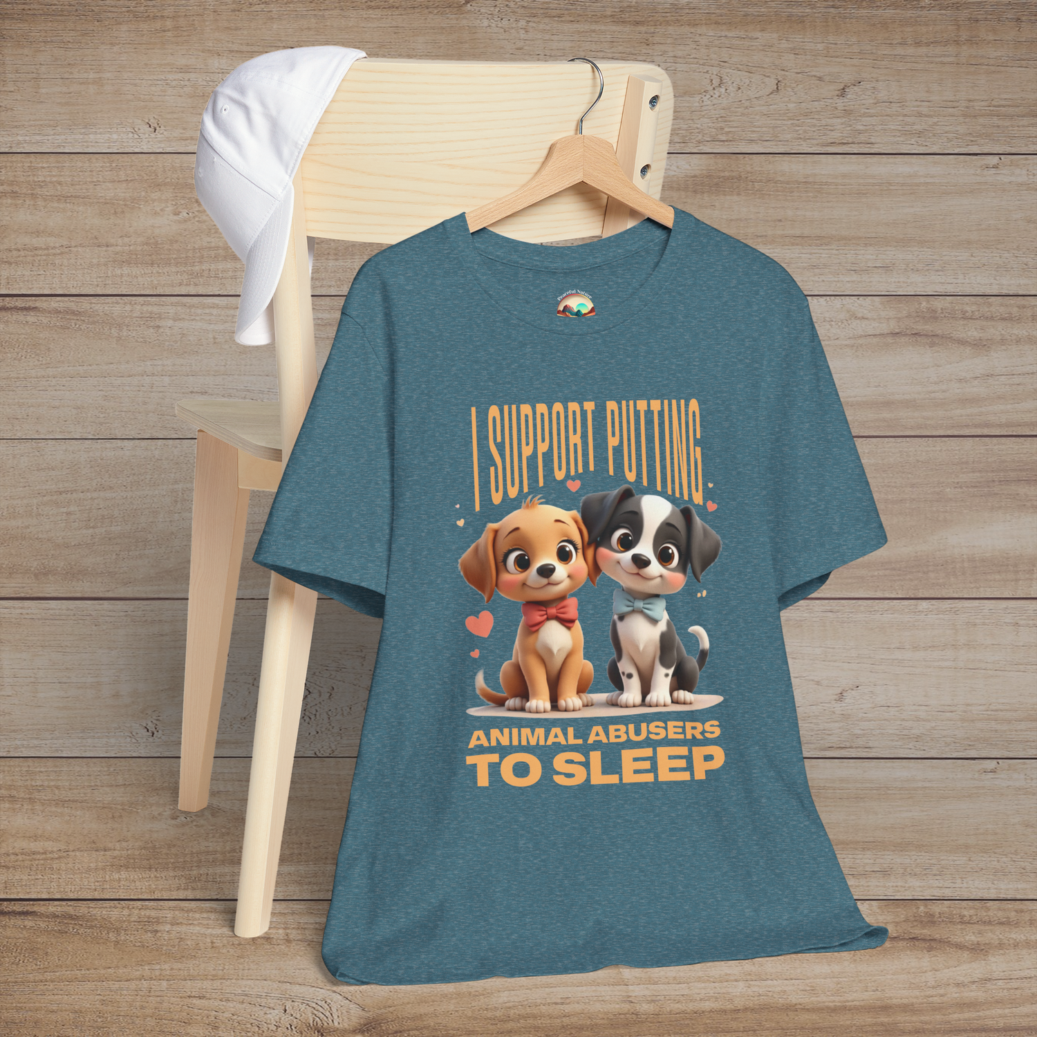 Heather deep teal tee with two sweet cartoon puppies in red and blue bows, plus bold message about stopping animal abuse