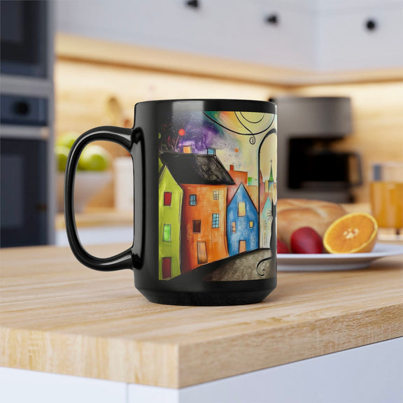 Black ceramic 15 oz mug with colorful artistic cityscape and black cat illustration, left view