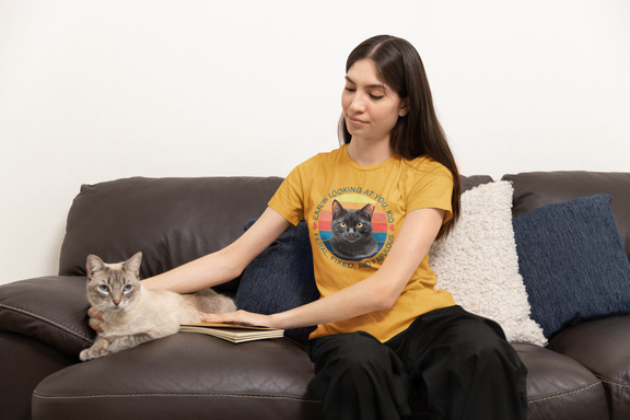 Woman wearing mustard Ear’s Looking at You Kid TNR cat shirt with retro ear-tipped black cat design, Bella Canvas 3001
