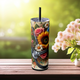 Glitter black skinny tumbler with vibrant flowers and stethoscope, front view