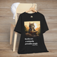 Books Are a Uniquely Portable Magic cat t-shirt in black displayed on a wooden chair