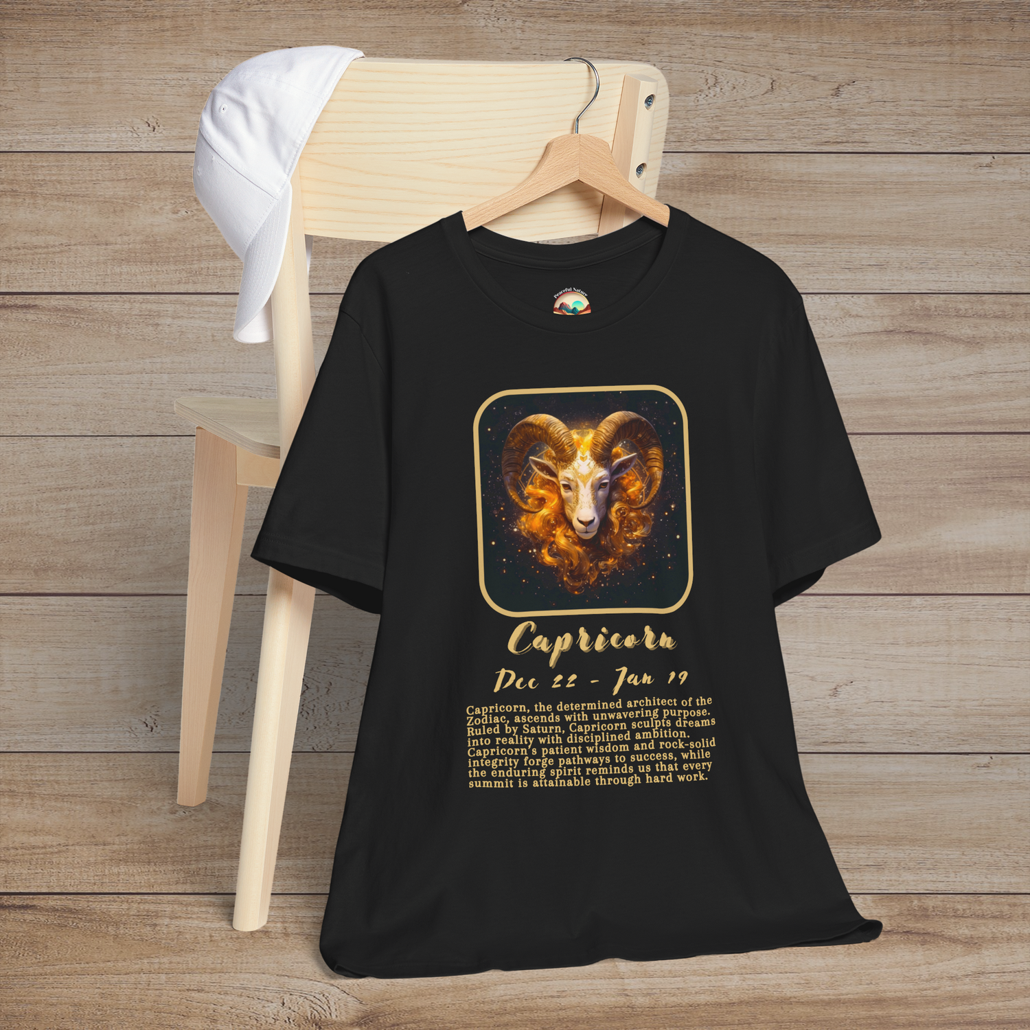 Black Capricorn Zodiac T-Shirt with a gold goat symbol, birth dates, and traits of ambition and discipline