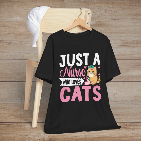 Black t-shirt featuring a cute cartoon orange cat wearing a nurse cap, holding a needle, with the text Just a Nurse Who Loves Cats