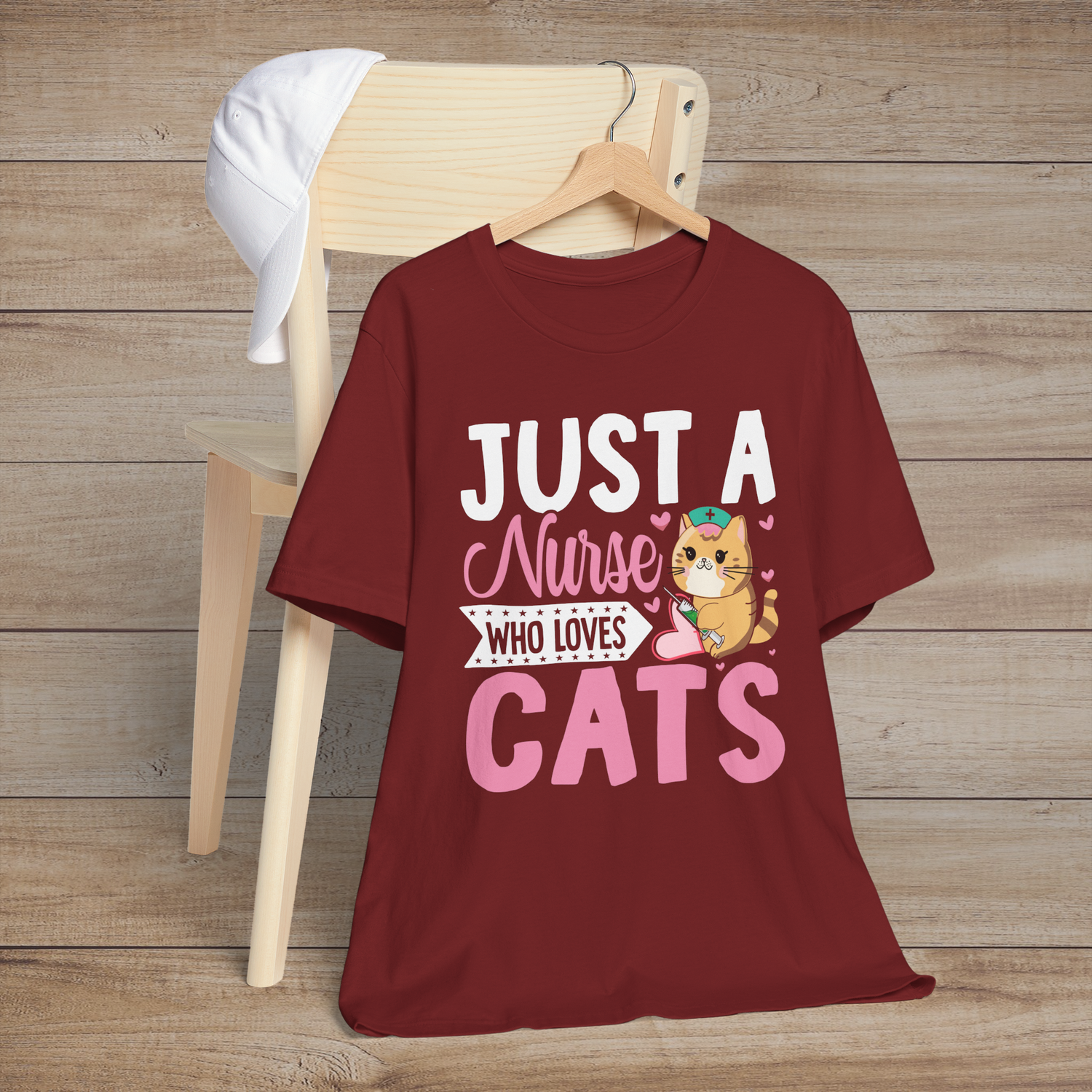 Cardinal red t-shirt with an adorable orange cat nurse design surrounded by pink hearts and the phrase Just a Nurse Who Loves Cats