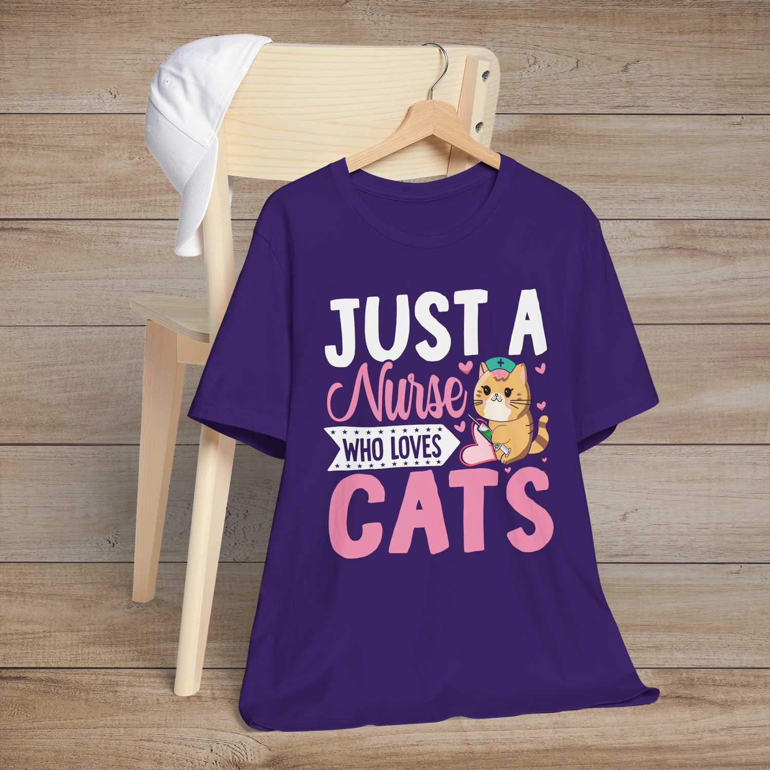 Purple t-shirt displaying a cute orange cat nurse with pink hearts and the words Just a Nurse Who Loves Cats
