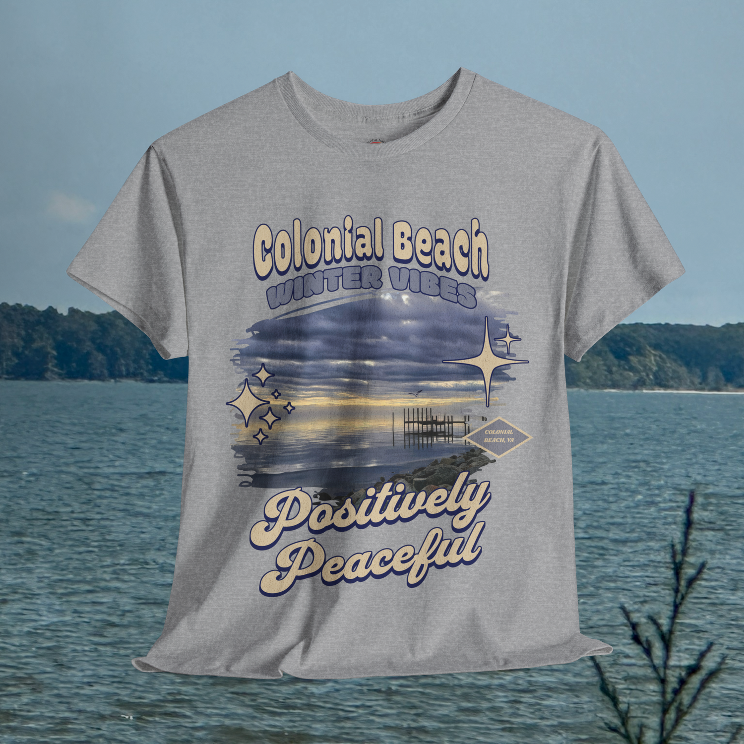 Colonial Beach Winter Vibes sport grey t-shirt hanging in front of a river scene