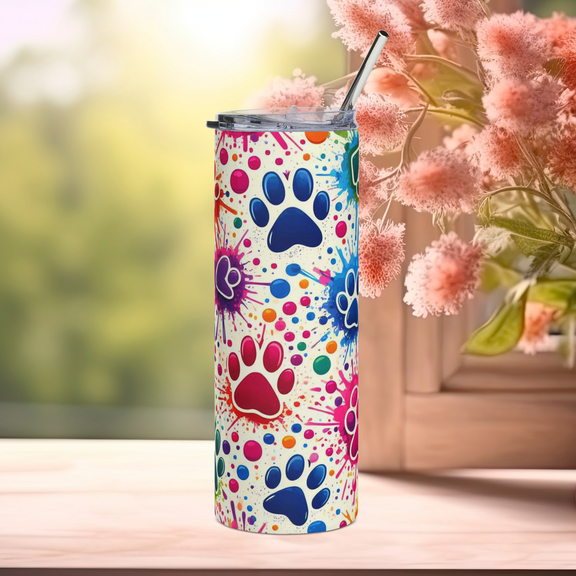 Front view of Color Splash Paw Print 20oz stainless steel tumbler with rainbow paw prints and paint splatter design – eco-friendly pet lover drinkware by Peaceful Nature Designs