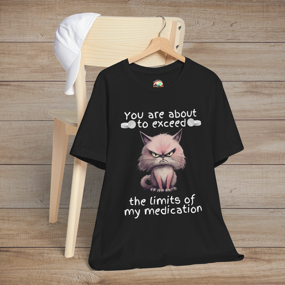 Funny cranky cat t-shirt in black featuring angry cartoon cat and sarcastic quote about medication limits, flat lay style for cat lovers and humor fans