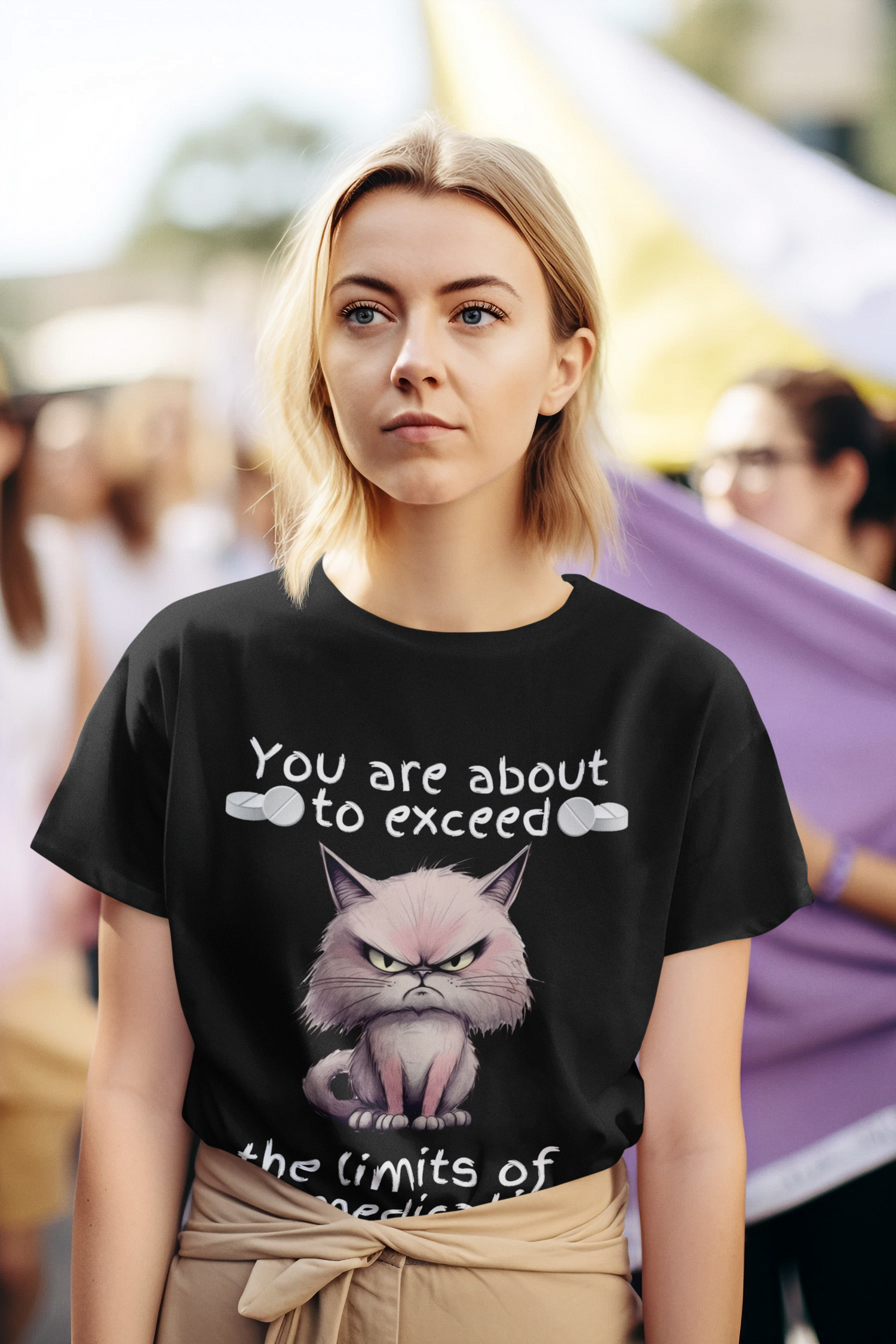 Woman wearing black cranky cat t-shirt at outdoor rally, featuring angry cartoon cat graphic and sarcastic medication quote, perfect funny gift for cat lovers