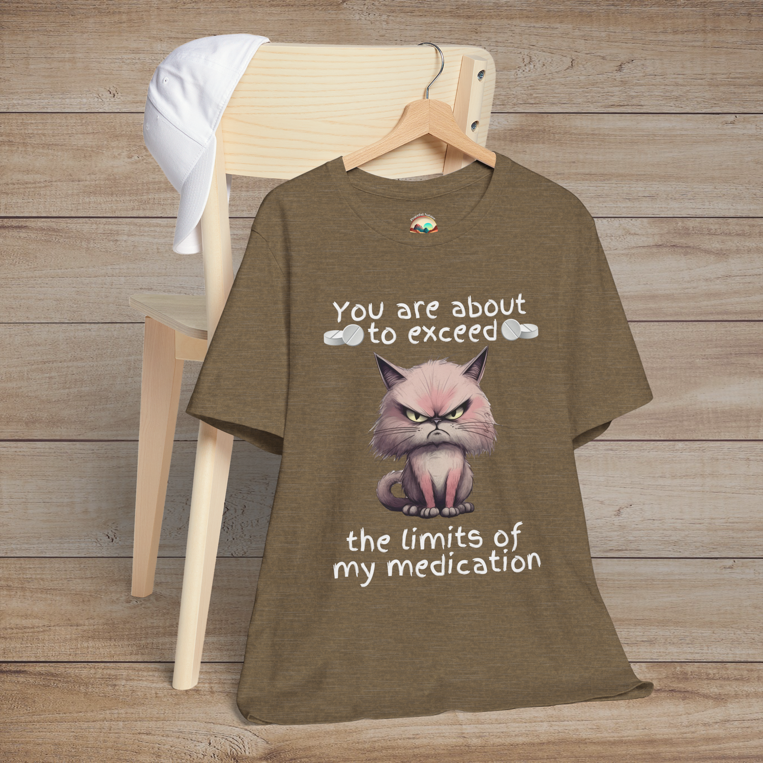 Heather olive funny cranky cat t-shirt featuring sarcastic angry cartoon cat and medication limits quote, laid flat for casual cat lover fashion
