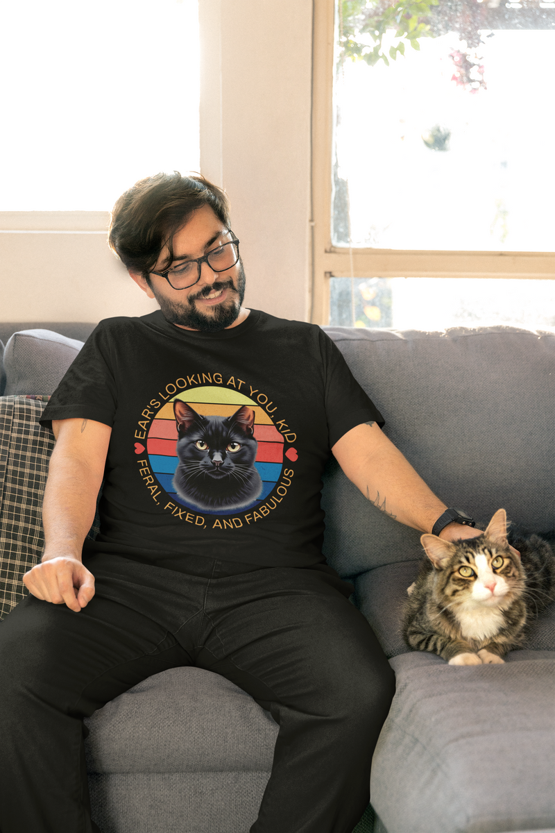 Man wearing black Ear’s Looking at You Kid TNR cat shirt with retro ear-tipped black cat design, Bella Canvas 3001