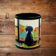 Black ceramic mug with black puppy illustration and vivid cityscape, 11 oz front-facing view
