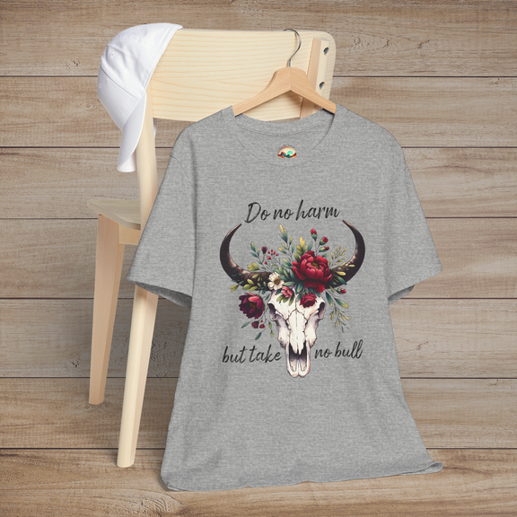 Flat lay of "Do No Harm But Take No Bull" t-shirt in heather grey with bull skull and floral crown