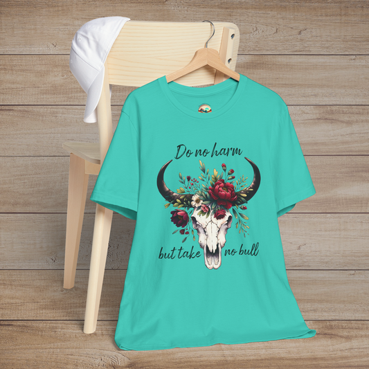 Flat lay of "Do No Harm But Take No Bull" t-shirt in teal with bull skull and floral crown