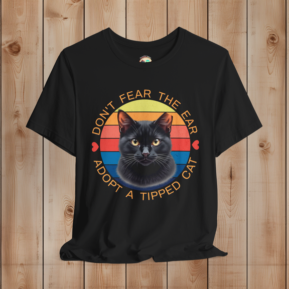 Black Bella Canvas t-shirt featuring black cat ear-tipped TNR design with retro sunset background