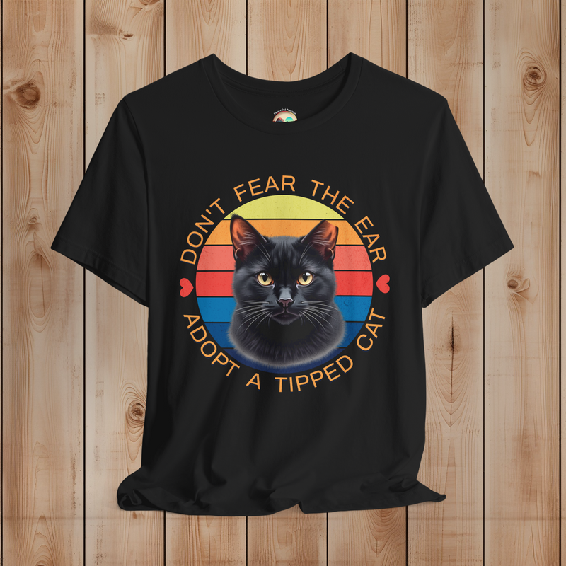 Black Bella Canvas t-shirt featuring black cat ear-tipped TNR design with retro sunset background