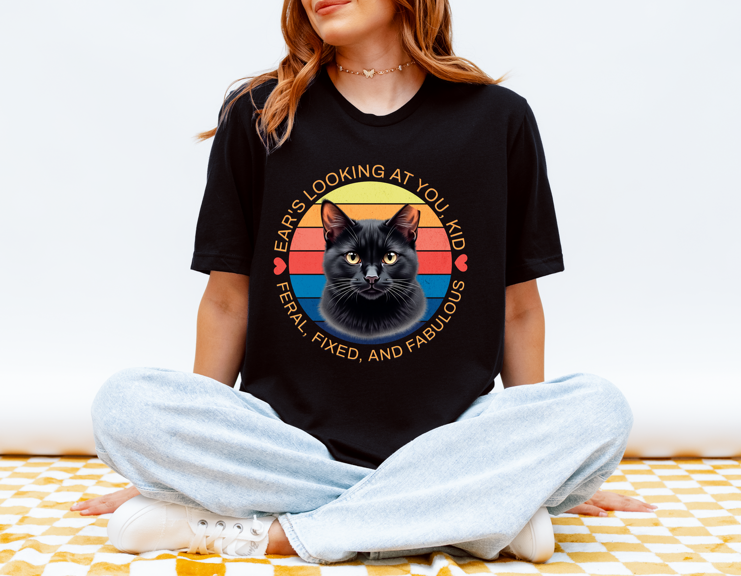 Woman wearing black Ear’s Looking at You Kid TNR cat shirt with retro ear-tipped black cat design, Bella Canvas 3001