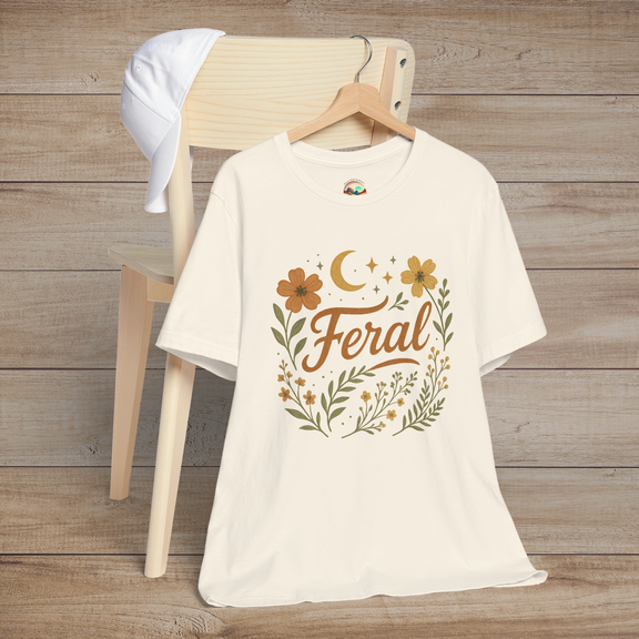 Feral t-shirt in Natural with floral and moon design in elegant calligraphy, displayed on a chair with a cap