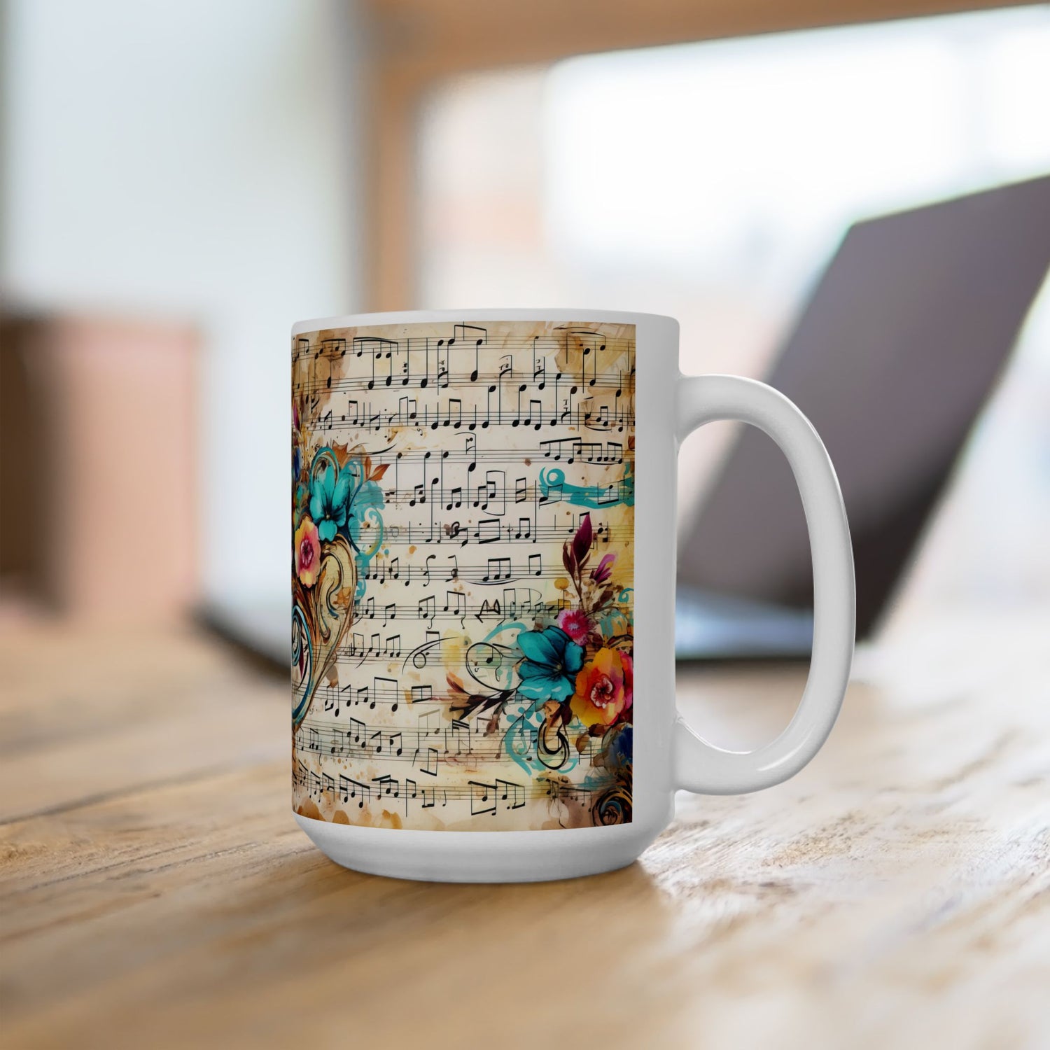 Right-side view of the 15 oz Floral Melody Mug in a bright café-style workspace. Features bold, colorful flowers and intricate musical notes printed over a vintage parchment background. Ideal for large hot beverages with a touch of elegance