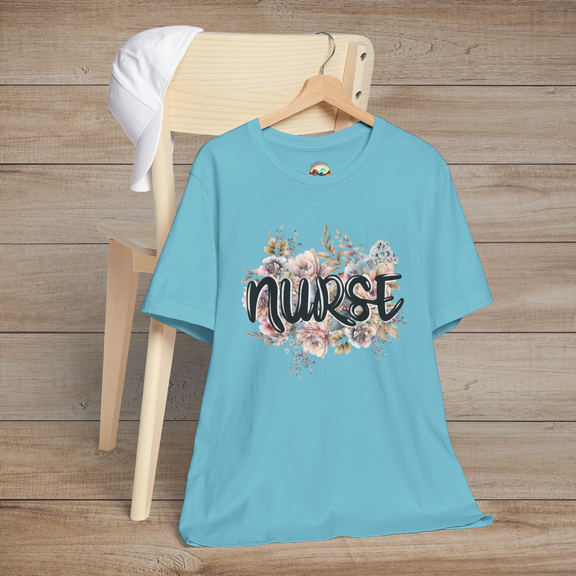 Turquoise Nurse Floral Premium Fit T-Shirt hanging on wooden hanger, featuring pastel floral design with graceful black text
