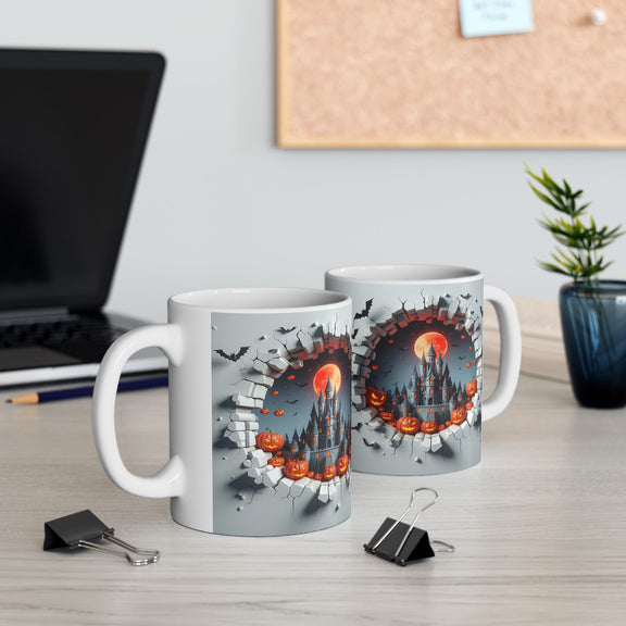 Left-side view of the 11 oz Halloween Mischief Mug, shown beside another mug 
 (right-view) on a modern desk. Features a haunted castle, glowing pumpkins, bats, and a wall-breaking effect. A great gift for Halloween lovers and office decor