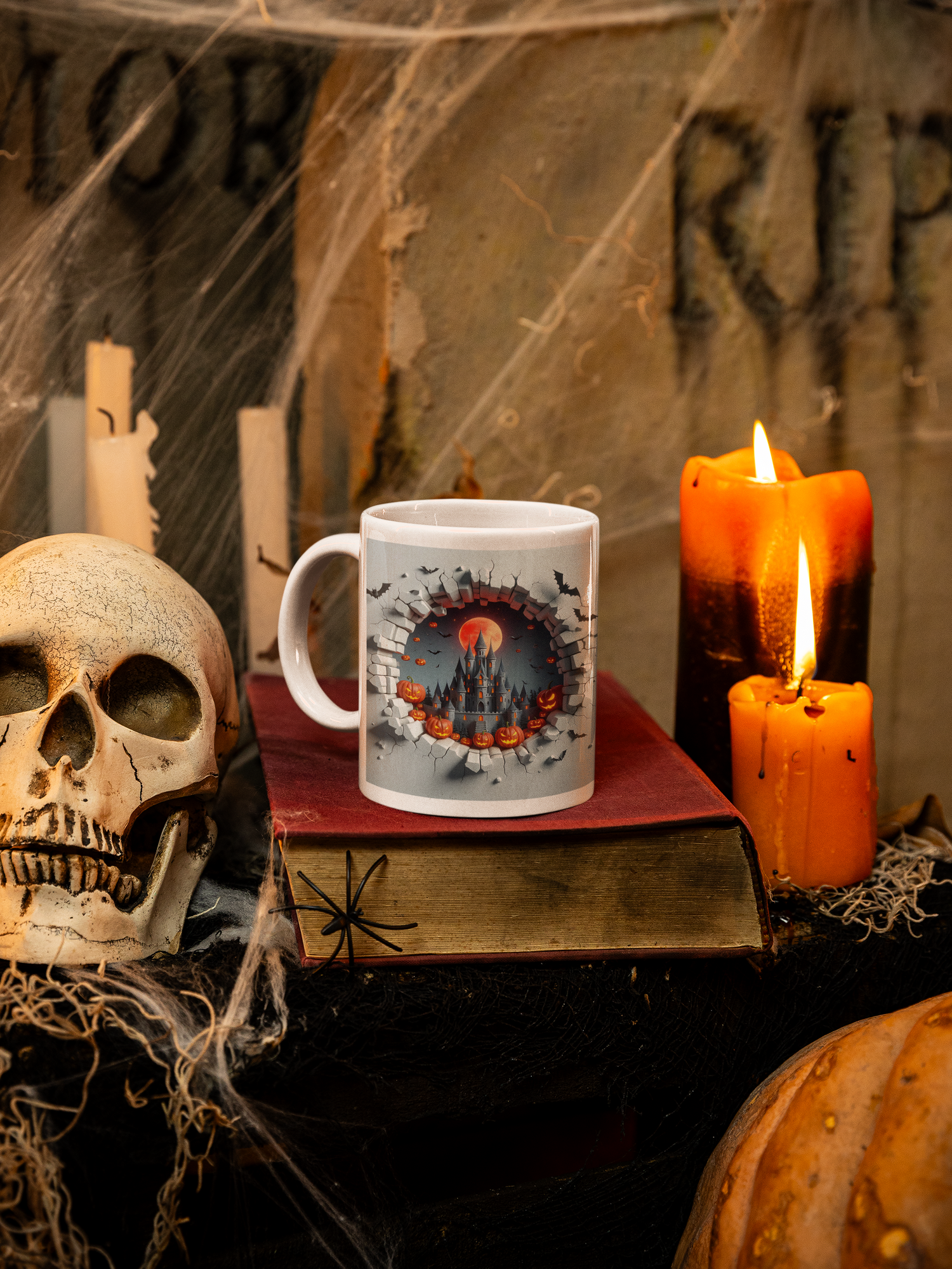 Halloween-themed setup with a mug, skull, candles, and pumpkins.