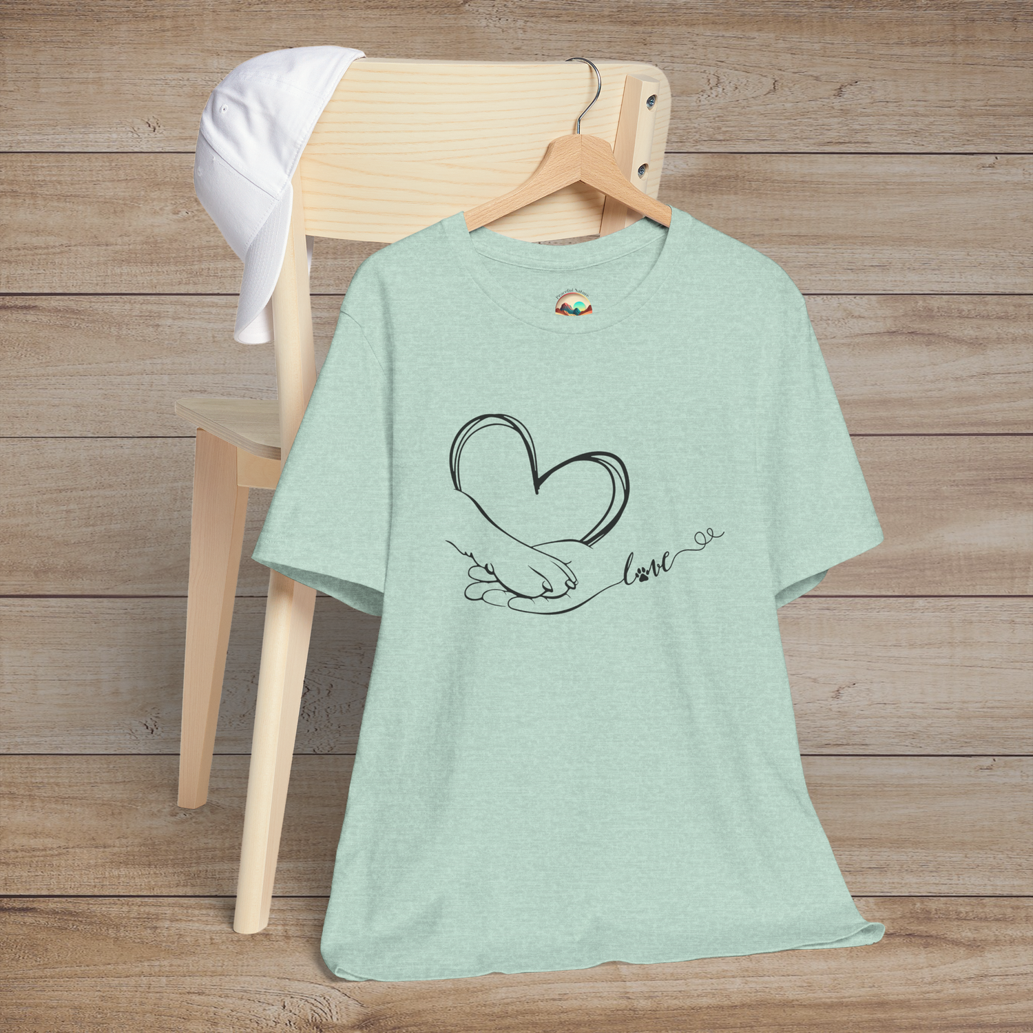 Heather prism mint t-shirt featuring minimalist black line art of a heart, human hand, and paw with love script