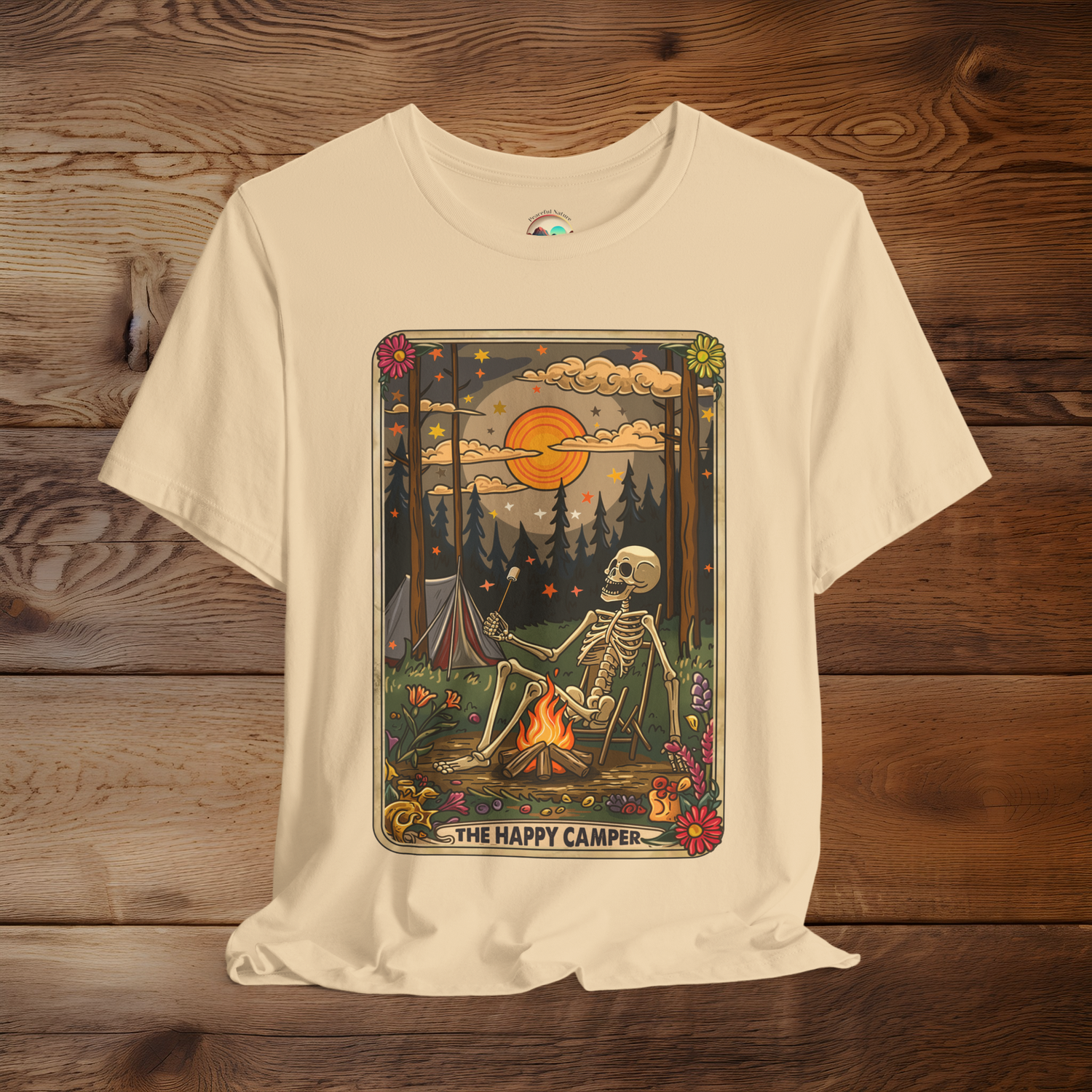 Soft Cream Happy Camper Tarot T-Shirt featuring a boho-gothic skeleton roasting marshmallows under a bright sun