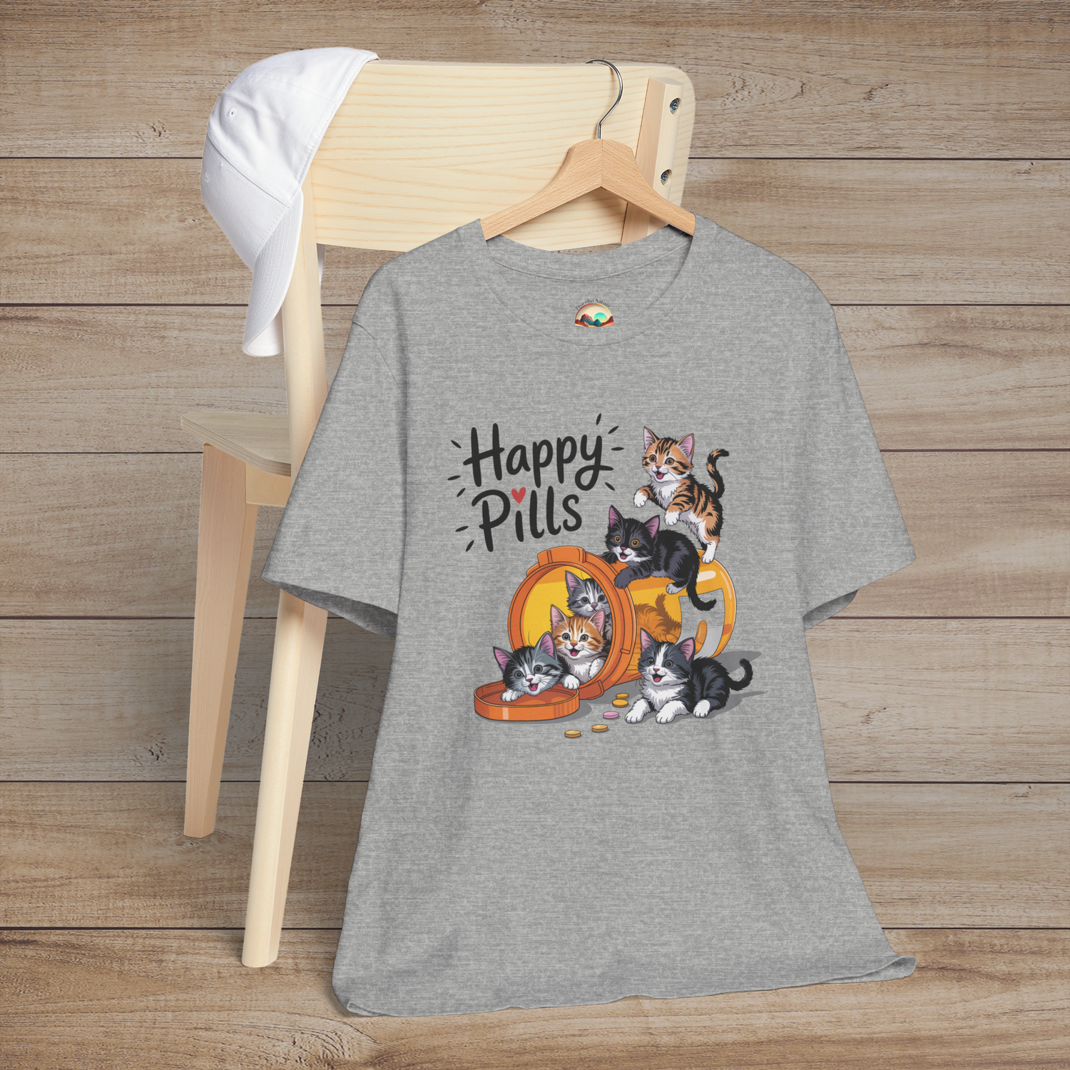 Happy Pills kitten t-shirt on heather grey (athletic heather) fabric with playful cats spilling from a pill bottle